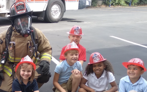 Smiling children on Kindergarten field trip to the local fire station 201